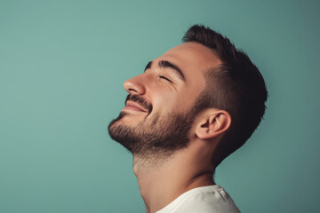 Obraz premium A close up of a man's face with his eyes closed