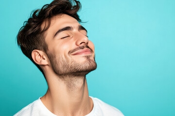 Fototapeta premium A close up of a man's face with his eyes closed