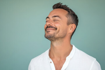 Fototapeta premium A close up of a man's face with his eyes closed