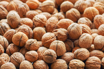 Top view of whole walnuts as background texture