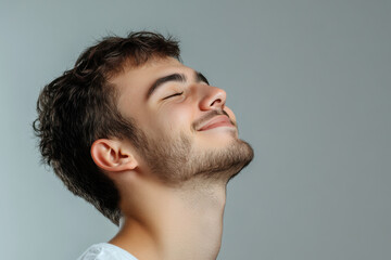 Fototapeta premium A close up of a man's face with his eyes closed