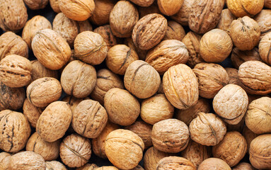 Top view of whole walnuts as background texture