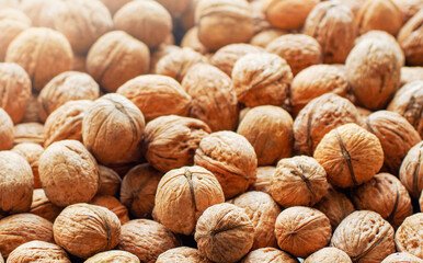 Top view of whole walnuts as background texture