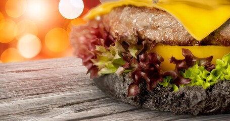 Tasty hot cheese beef burger on desk