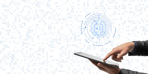 Hands interacting with a tablet displaying an AI brain icon on a digital grid background, representing technology and machine learning