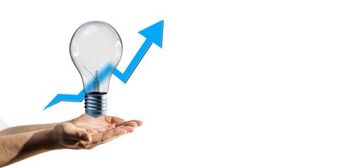 Hand holding a light bulb with a blue arrow going upwards, symbolizing growth, innovation, and...
