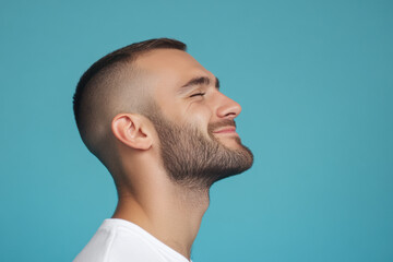 Fototapeta premium A close up of a man's face with his eyes closed