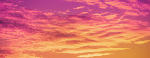 Colorful flaming sky at sunset. Color gradient. Sky texture. Abstract nature background. Horizontal banner