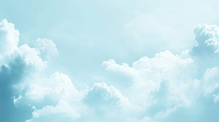 A serene sky filled with soft, fluffy clouds in a light blue atmosphere.
