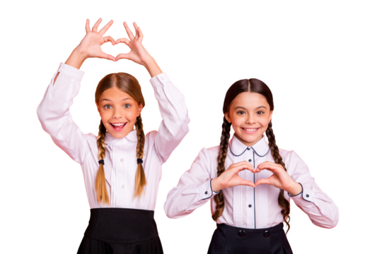 Portrait of two person nice attractive charming cute cheerful cheery lovable funny pre-teen girls showing heart shape isolated over bright vivid shine orange background