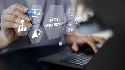 A businessman using laptop with Incident management concept on visual screen.