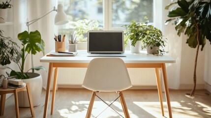 Clean and organized workspace with a simple desk setup, including a laptop and a few personal items.