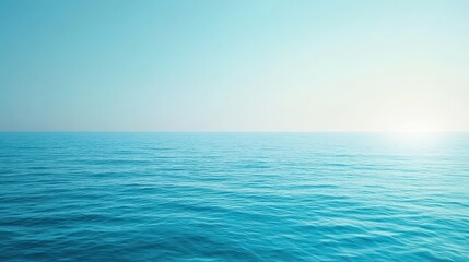 Fototapeta premium A serene view of calm ocean waters under a clear blue sky.