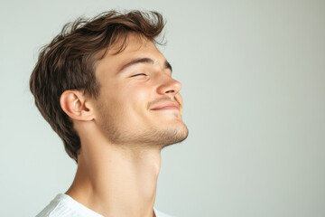 Fototapeta premium A close up of a man's face with his eyes closed