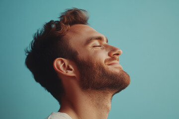 Obraz premium A close up of a man's face with his eyes closed