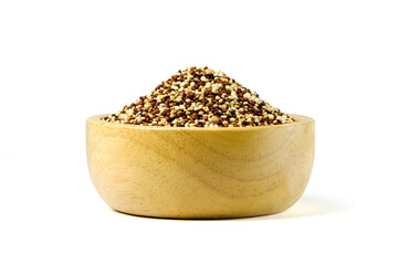 Dry black and white quinoa (Chenopodium quinoa)  seeds in wooden bowl isolated on white background stack with clipping path closed up. Healthy food concept.