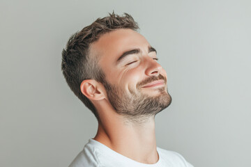 Obraz premium A close up of a man's face with his eyes closed