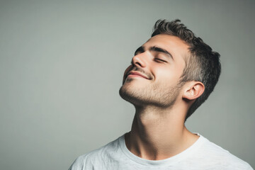 Obraz premium A close up of a man's face with his eyes closed