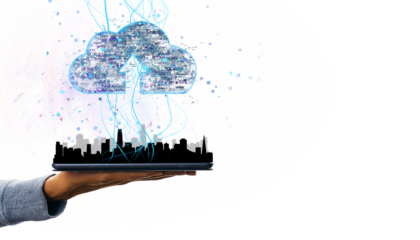 A hand holds a tablet with a glowing digital cloud hologram floating above it. White background, concept of cloud computing and data storage