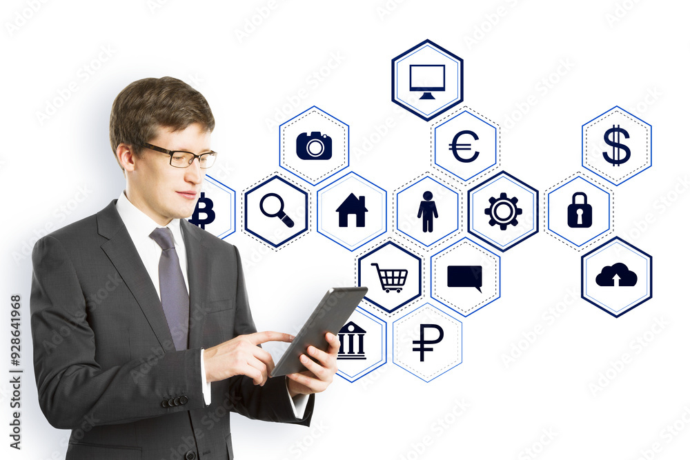 Poster businessman in a suit using a tablet with blue virtual holographic icons floating on a white backgro