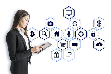 Businesswoman using a tablet, surrounded by white holographic business icons on a white background, representing digital space concept
