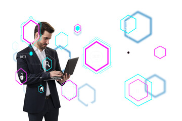 A man in a suit using a laptop surrounded by virtual icons and holograms. The background is white,...