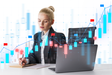 Businesswoman analyzing stock market data on a laptop with holographic graphs overlay on a white background. Concept of financial analysis and investment