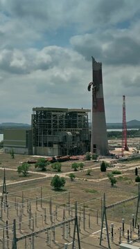 Aerial view of a dismantled obsolete oil-fired thermal power plant in Aramon, France. Vertical video