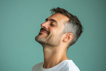 Obraz premium A close up of a man's face with his eyes closed