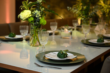 table set for a wedding reception, interior of a restaurant, room interior, table setting at restaurant, wedding table setting, table set for a dinner