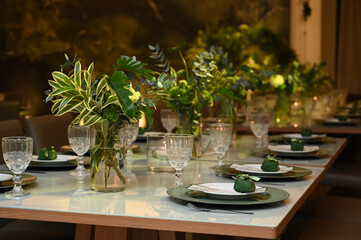 table set for a wedding reception, interior of a restaurant, room interior, table setting at restaurant, wedding table setting, table set for a dinner
