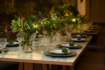 table set for a wedding reception, interior of a restaurant, room interior, table setting at restaurant, wedding table setting, table set for a dinner