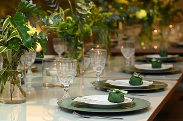 table set for a wedding reception, interior of a restaurant, room interior, table setting at restaurant, wedding table setting, table set for a dinner