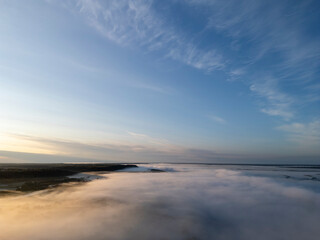 Obraz premium Sunrise Over Foggy Forest Landscape