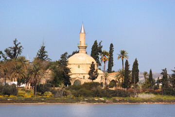 Panoramic view of the mosque Hala Sultan Tekke on the salt lake of Larnaka, Cyprus during sunny day with blue sky