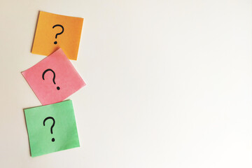 Note papers with question mark on white background