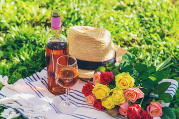 Wine flowers picnic in the garden. Selective focus.
