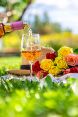 Wine flowers picnic in the garden. Selective focus.