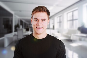 Happy professional business man posing in office.