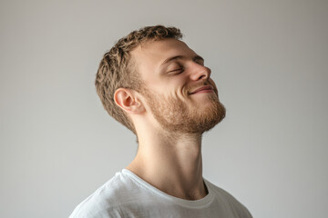 Obraz premium A close up of a man's face with his eyes closed