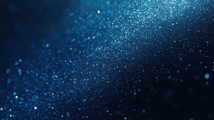 Naklejka premium A shimmering blue background with scattered light particles, creating a dreamy atmosphere.
