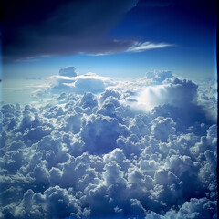 view from airplane window clouds above the sky