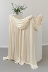 Draped Fabric on a White Platform