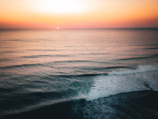 Ocean beach landscape. Inspire tropical beach seascape horizon with surfers at golden hour with...