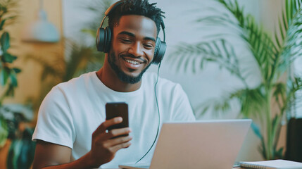 Fototapeta premium Person with headphones, laptop and smartphone.