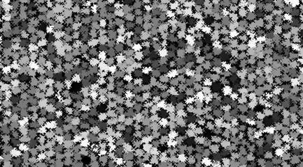 A black and white photo of a gray and white background with many small dots. The photo has a monochromatic color scheme and he is a pattern or texture