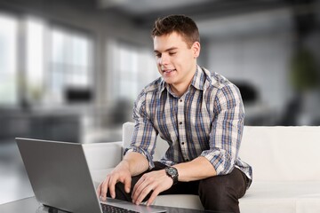 Happy business man sitting in office.