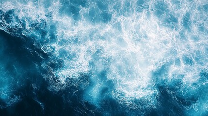 Fototapeta premium A top down view of ocean waves creating water patterns suitable as a background image with copy space