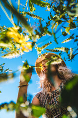 Woman in the park with flowers summer. Selective focus.