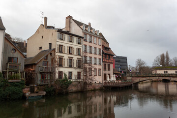 Fototapeta premium Bridges and old buildings on the embankment of the river Ile